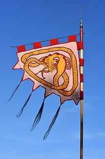 flag, banner, symbol, flutter, air, blue sky, waving flag, sky, blue, no people, nature, clear sky, communication, day, low angle view, sign, outdoors, single object, red, pattern, the past, craft, history, art and craft, architecture, 5K, CC0, public domain, royalty free