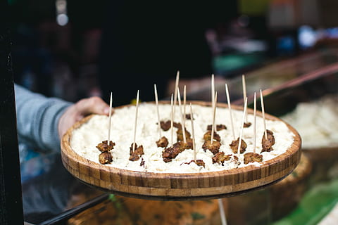fried cheese platter, Fried cheese, platter, cheese, close up, hands, market, food, gourmet, people, one person, food and drink, human body part, one man only, freshness, focus on foreground, hand, human hand, holding, real people, indoors, selective focus, close-up, unrecognizable person, lifestyles, leisure activity, sweet food, incidental people, dessert, finger, snack, tray, temptation, 5K