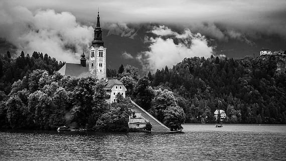 gray-scale photography, house, surrounded, trees, body, water, daytime, gray-scale, photography, body of water, black And White, church, history, famous Place, river, old, architecture, built structure, tree, no people, building exterior, plant, building, tower, nature, sky, place of worship, waterfront, travel destinations, day, the past, cloud - sky, outdoors, spire, 2K, CC0, public domain, royalty free