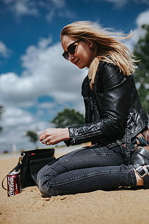 young, woman, wearing, leather jacket, sunglasses, beach, on the beach, female, girl, sand, summer, relaxing, beautiful, jacket, jeans, leather, blonde, women, people, outdoors, one Person, young Adult, females, blond Hair, fashion, caucasian Ethnicity, beauty, adult, only women, one woman only, sitting, young women, real people, casual clothing, clothing, lifestyles, leisure activity, black color, hair, day, glasses, hairstyle, beautiful woman, 4K