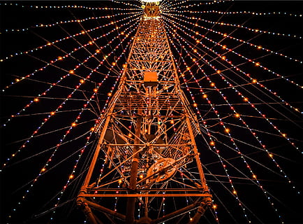 low-angle photography, red, metal tower, surrounded, turned, assorted-color string lights, night, string lights, tower, dark, evening, illuminated, low angle view, no people, amusement park, arts culture and entertainment, amusement park ride, decoration, built structure, lighting equipment, glowing, architecture, ferris wheel, pattern, celebration, christmas, travel destinations, outdoors, sky, light, 1080P, CC0, public domain, royalty free