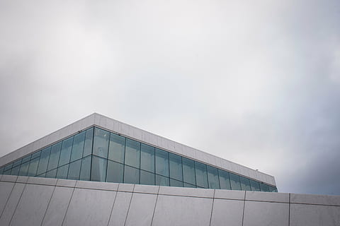 low-angle photo, gray, concrete, building, green, glass windows, low, angle, photography, sky, architecture, infrastructure, cloud, rooftop, day, outdoors, built structure, no people, modern, building exterior, city, nature, business, copy space, cloud - sky, overcast, office, facade, building feature, steel, 2K, CC0, public domain, royalty free