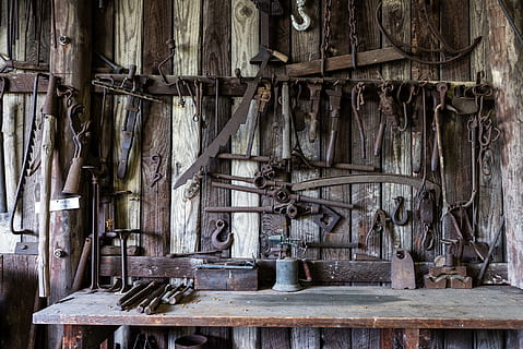 assorted tools, blacksmith, tools, shop, rustic, old, antique, vintage, metal, craft, iron, workshop, metalwork, wood - material, no people, indoors, history, day, abandoned, the past, architecture, damaged, rusty, bad condition, large group of objects, weathered, building, equipment, full frame, metal industry, 1080P, CC0, public domain, royalty free