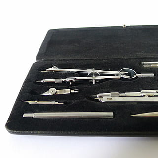 compass, drawing, technical, draw, geometry, geometric, geometries, tools, confection, case, tip, hand, circle, pencil, whether, sheet, studio shot, still life, white background, no people, indoors, close-up, cut out, metal, black color, high angle view, man made, fashion, man made object, in a row, equipment, stack, office, bag, table, personal accessory, 2K, CC0, public domain, royalty free