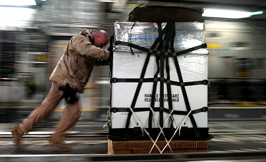 man, brown, jacket, cargo, handler, work, transportation, shipping, loading, crate, load, container, task, job, laborer, labor, freight, pallet, industry, blurred motion, motion, real people, men, full length, one person, speed, architecture, side view, day, on the move, occupation, outdoors, water, mode of transportation, running, walking, lifestyles, effort, 1080P, CC0, public domain, royalty free