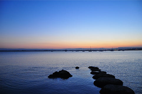 seascape photography, city skyline, sunset, dusk, dark, lake, water, boats, docks, marina, harbor, harbour, shadows, nature, silhouette, reflection, scenics, sea, outdoors, sky, tranquility, scenics - nature, beauty in nature, tranquil scene, rock, rock - object, blue, solid, clear sky, no people, land, idyllic, beach, 1080P, CC0, public domain, royalty free