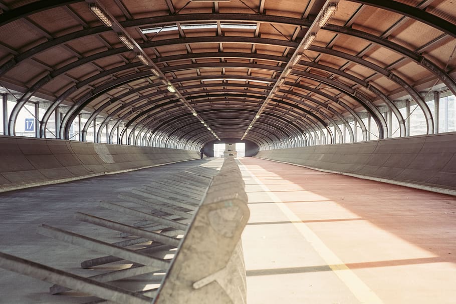 road, tunnel, empty, sunlight, shadow, glass, window, architecture, arch, built structure, indoors, no people, transportation, day, ceiling, the way forward, direction, rail transportation, railroad station, absence, pattern, diminishing perspective, arched, connection, 4K