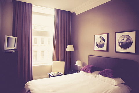 brown, wooden, bed, opened, window, hotel room, pillows, frames, decor, furniture, curtains, laps, tv, television, domestic room, indoors, bedroom, relaxation, one person, lifestyles, adult, lighting equipment, curtain, home interior, lying down, hotel, luxury, electric lamp, contemplation, cozy, 4K, CC0, public domain, royalty free