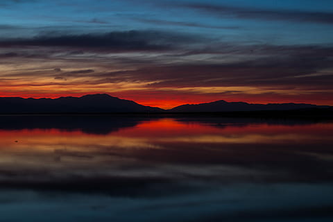 landscape photography, island, surrounded, fog, golden, hour, body of water, sunset, background, cloudscape, cloud, dawn, dusk, relfection, symmetry, symmetrical, landscape, orange, gold, blue, red, nature photography, sky, scenics - nature, beauty in nature, water, tranquility, tranquil scene, cloud - sky, orange color, idyllic, lake, silhouette, mountain, no people, reflection, nature, waterfront, non-urban scene, dramatic sky, romantic sky, 5K, CC0, public domain, royalty free