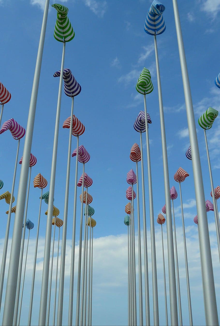 Flagpole, Masts, Hoist, Flag, sky, rod, wind shear, blow, flutter, flagpoles, hoisted, wind pants, high, metal, metal rods, azure, blue, color, colorful, perpektive, striped, clouds, north sea, coast, holiday, travel, holidays, maritime, arts culture and entertainment, low angle view, no people, day, outdoors, built structure, architecture, cloud - sky, nature, building exterior, travel destinations, tall - high, amusement park ride, amusement park, city, building, tourism, tower, spire, 2K