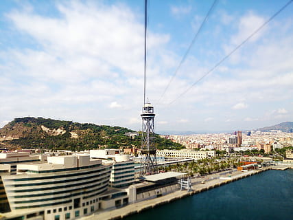 barcelona, elevator, bay, architecture, built structure, building exterior, sky, city, cloud - sky, building, cityscape, nature, water, tower, no people, day, residential district, high angle view, tall - high, outdoors, office building exterior, skyscraper, spire, 1080P, CC0, public domain, royalty free
