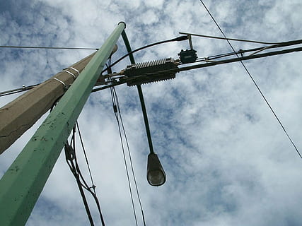 light, source, lamp, lighting, focus, posts, equipment, sky, cloud - sky, low angle view, day, nature, transportation, cable, outdoors, no people, industry, connection, construction industry, mode of transportation, pole, metal, rope, electricity, overcast, architecture, technology, power supply, telephone line, 720P, CC0, public domain, royalty free