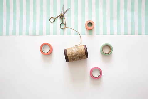 silver scissor, sewing threads, scissors, cotton, sewing, design, fabric, thread, textile, craft, needle, equipment, tailor, material, clothing, sew, spool, fashion, retro, needlework, tool, bobbin, texture, studio shot, indoors, directly above, no people, still life, table, food and drink, group of objects, white background, striped, pattern, copy space, drink, simplicity, accuracy, medium group of objects, blue, close-up, food, 5K, CC0, public domain, royalty free