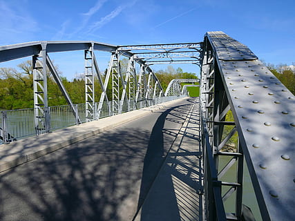 gray steel bridge, bridge, metal, structure, shadow, bridge - man made structure, sky, connection, nature, transportation, architecture, built structure, day, sunlight, railing, no people, the way forward, plant, direction, diminishing perspective, outdoors, long, steel, 4K, CC0, public domain, royalty free