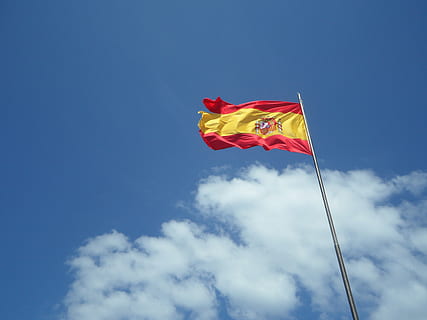 spain, flag, flutter, sky, blue, clouds, wind, windy, hoisted, low angle view, cloud - sky, patriotism, nature, red, environment, day, no people, waving, pole, outdoors, emotion, sunlight, striped, copy space, 4K, CC0, public domain, royalty free
