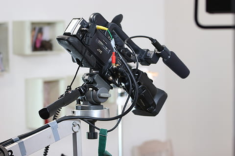 black professional camera, camera, video camera, lens, technology, digital, film, handcam, camera crane, studio, sound, sound recording, hdtv, battery, tripod, advertising film, equipment, focus on foreground, microphone, input device, no people, communication, indoors, close-up, recording studio, photography themes, bicycle, connection, day, still life, domestic room, audio equipment, transportation, 1080P, CC0, public domain, royalty free