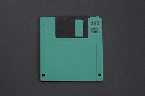green floppy disk, old technology, storage, green color, gray, gray background, indoors, studio shot, single object, close-up, no people, technology, black background, colored background, cut out, industry, communication, architecture, directly above, equipment, history, the past, push button, 2K, CC0, public domain, royalty free