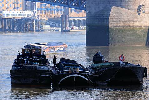 barges, river, refuse service, thames, london, transportation, water, nautical vessel, architecture, built structure, mode of transportation, waterfront, bridge, day, connection, bridge - man made structure, ship, no people, building exterior, travel, pier, outdoors, 4K, CC0, public domain, royalty free