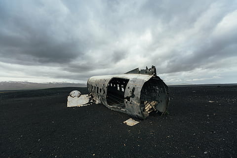 grayscale photo, abandoned, plane, gray, clouds, photo, airplane, mountain, dark, cloudy, sky, metal, steel, crash, sand, cloud - sky, damaged, destruction, no people, military airplane, outdoors, nature, land, transportation, mode of transportation, obsolete, environment, landscape, old, day, air vehicle, ruined, history, horizon over land, deterioration, climate, demolished, 5K, CC0, public domain, royalty free