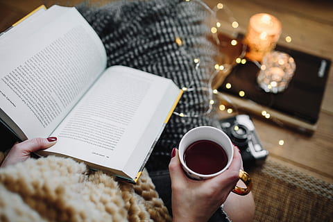 woman drinking tea, reading book, Woman, drinking, tea, female, home, book, reading, time, pillows, comfortable, cozy, hygge, fruit tea, fairy lights, coffee - Drink, people, human hand, human body part, one person, adults only, adult, food and drink, coffee, hand, cup, drink, coffee cup, refreshment, mug, indoors, lifestyles, publication, holding, table, real people, food, breakfast, crockery, 5K