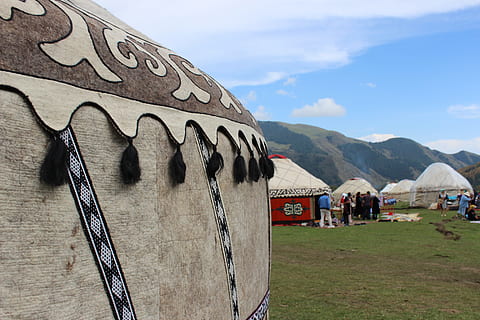 yurt, nomad games, canyon, architecture, mountain, built structure, cloud - sky, sky, day, building exterior, nature, building, landscape, grass, outdoors, environment, beauty in nature, plant, no people, mountain range, travel, religion, 5K, CC0, public domain, royalty free