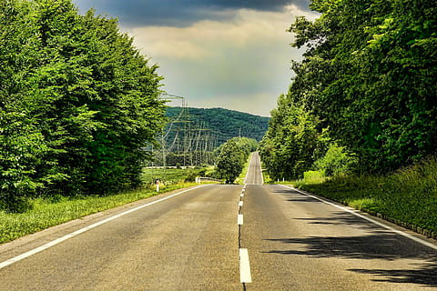 gray, concrete, road, trees, daytime, landscape, empty road, forest, hill, clouds, just, rural, asphalt, summer, plant, tree, transportation, the way forward, sky, direction, road marking, marking, nature, green color, diminishing perspective, symbol, sign, no people, vanishing point, cloud - sky, beauty in nature, day, growth, outdoors, dividing line, treelined, 5K, CC0, public domain, royalty free