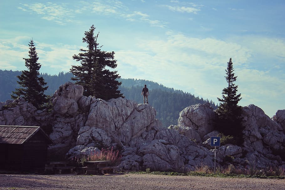 person, standing, grey, rock, blue, sky, mountains, hiking, glory, adventure, landscape, backpacker, mountain top, peak, achievement, success, mountain climber, dom, travel, hike, nature, tree, plant, beauty in nature, cloud - sky, day, mountain, environment, tranquil scene, growth, scenics - nature, land, tranquility, field, non-urban scene, solid, rock - object, no people, outdoors, 5K