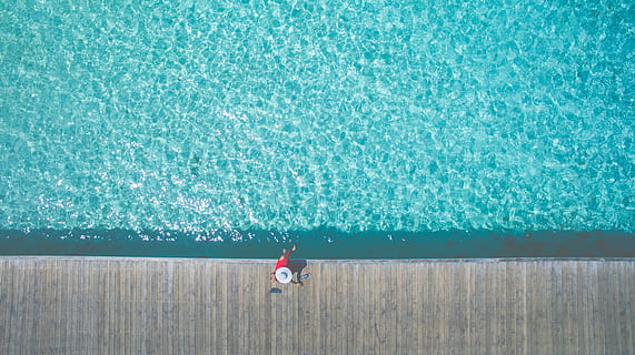 person, sitting, dock, body, water, aerial, photography, near, pool, sea, ocean, nature, pathway, sunny, summer, vacation, people, woman, alone, swimming pool, leisure activity, day, outdoors, vacations, one person, real people, swimming, lifestyles, men, high angle view, full length, child, blue, boys, childhood, rear view, turquoise colored, 4K, CC0, public domain, royalty free