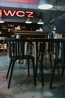 pub, Interior, table, coffee, bar, glasses, drinks, alcohol, liquor, restaurant, cafe, bar - Drink Establishment, chair, night, food, dining, food and drink, seat, business, indoors, empty, absence, no people, wood - material, focus on foreground, furniture, illuminated, drink, arrangement, food and drink industry, bar counter, electric lamp, setting, cafeteria, 4K, CC0, public domain, royalty free