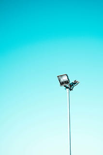 low, angle photography, lamp post, sky, blue, post, light, steel, spotlight, copy space, studio shot, single object, no people, colored background, backgrounds, day, low angle view, clear sky, nature, metal, lighting equipment, floodlight, pole, tall - high, outdoors, close-up, technology, street light, still life, silver colored, turquoise colored, blue background, 5K, CC0, public domain, royalty free