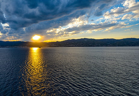 sicily, sunset, sky, clouds, blue, boat, sun, rays, sea, mediterranean, travel, water, reflection, dusk, outdoors, bay, light, italy, nature, lake, summer, scenics, cloud - sky, beauty in nature, scenics - nature, tranquility, tranquil scene, mountain, sunlight, no people, idyllic, waterfront, dramatic sky, non-urban scene, 2K, CC0, public domain, royalty free