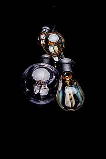 four light bulbs, light bulbs, glass - Material, reflection, luxury, elegance, black background, no people, studio shot, luxury hotel, close-up, indoors, copy space, still life, cut out, shiny, creativity, metal, representation, technology, two objects, jewelry, dark, lighting equipment, art and craft, 5K, CC0, public domain, royalty free