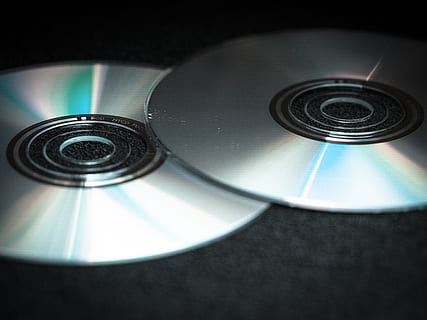 two gray discs, dvd, cd, blank, computer, digital, silver, disk, data, glassy, data medium, refraction, film, shiny, technology, compact disc, music, arts culture and entertainment, indoors, close-up, record, no people, equipment, retro styled, communication, circle, wireless technology, black color, audio equipment, turntable, 4K, CC0, public domain, royalty free
