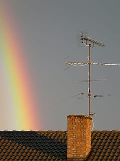 Rainbow, Phenomenon, Sunshine, rain, refraction, sky, nature, spectrum, colorful, natural phenomenon, rainbow colors, ray, natural spectacle, of course, spectacular, clouds, half circle, antenna, roof, house roof, no people, architecture, outdoors, building exterior, built structure, communication, low angle view, technology, antenna - aerial, building, roof tile, day, direction, house, clear sky, 2K, CC0, public domain, royalty free