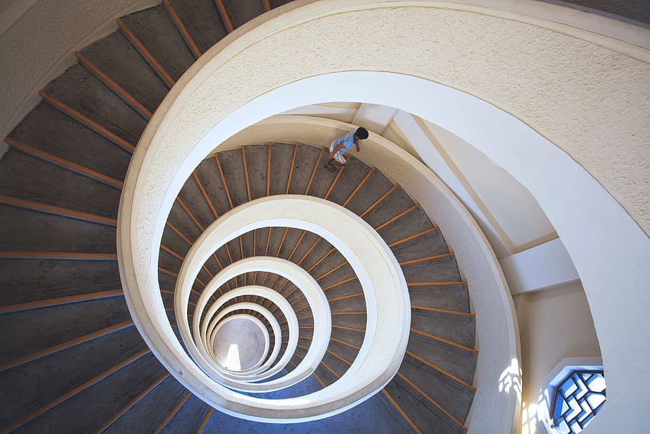 building, interior, Spiral staircase, architecture, staircase, steps, spiral, indoors, railing, curve, no People, modern, bannister, built Structure, architecture And Buildings, design, steps and staircases, high angle view, directly above, shape, pattern, wood - material, geometric shape, circle, one person, architectural feature, day, 4K