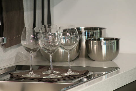 Glasses, Tableware, Kitchen, cooking tools, pots, table, indoors, no people, preparation, food and drink, reflection, shelf, glass, household equipment, glass - material, still life, transparent, arrangement, drinking glass, wineglass, close-up, domestic room, refreshment, alcohol, empty, absence, drink, group of objects, steel, silver colored, tray, 5K, CC0, public domain, royalty free