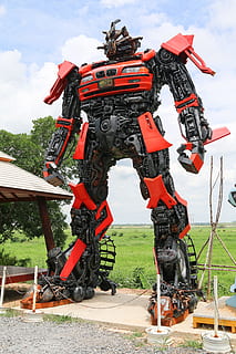 rouge, noir, statue de robot, ai, intelligence artificielle, machine, apprentissage automatique, robot, statue, ciel, journée, la nature, mode de transport, en plein air, machinerie, transport, véhicule terrestre, casque, La technologie, champ, personne, plante, couvre-chef, nuage - ciel, sécurité, herbe, sport, roue, 5K, CC0, domaine public, libre de droits