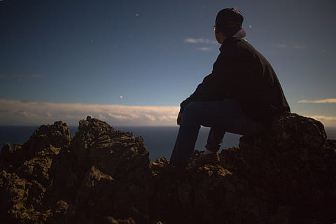 alone, landscape, man, mountain, nature, outdoors, person, rocks, silhouette, sky, solo, one person, rock, sitting, rock - object, solid, leisure activity, real people, lifestyles, men, scenics - nature, full length, tranquil scene, tranquility, beauty in nature, rock formation, 5K