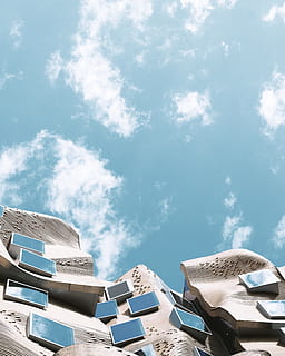 bottom-view, building, daytime, worm, eye view photography, cloudy, blue, sky, low angle, photography, brown building, no People, stack, book, outdoors, heap, cloud - sky, day, built structure, architecture, nature, building exterior, sunlight, low angle view, white color, roof, city, modern, house, travel destinations, sunny, 4K, CC0, public domain, royalty free