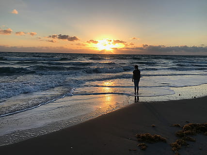 Sunrise, Potential, Vision, Sunset, Sun, adventure, coast, beach, sea, silhouette, wave, sand, land, water, sky, beauty in nature, scenics - nature, real people, horizon over water, horizon, one person, leisure activity, lifestyles, standing, orange color, idyllic, full length, 4K, CC0, public domain, royalty free