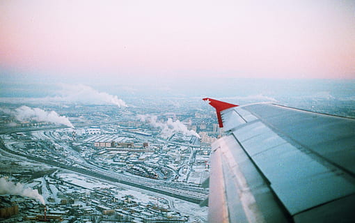 aerial, photography, airplane wing, city, smoke, plane, airplane, wing, clouds, sky, travel, adventure, trip, vacation, transportation, cityscape, no people, architecture, outdoors, built structure, air vehicle, building exterior, nature, flying, day, building, travel destinations, aerial view, mode of transportation, landscape, 2K, CC0, public domain, royalty free