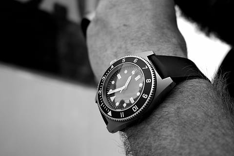 person, wearing, analog, watch, strap, round, silver, time, wrist, fashion, accessories, black and white, clock, wristwatch, minute hand, clock face, human body part, human hand, pocket watch, one person, hand, men, body part, real people, focus on foreground, close-up, lifestyles, instrument of time, selective focus, indoors, day, accuracy, human limb, personal accessory, checking the time, finger, 2K