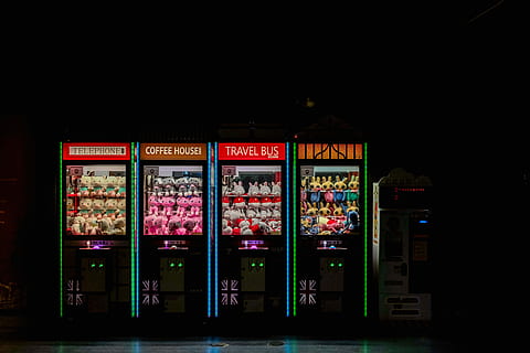 plush, toy vending machine, black-and-multicolored electronic devices, arcade, lights, win, neon, night, teddies, teddy, text, food and drink, western script, architecture, communication, retail, no people, store, city, illuminated, multi colored, choice, vending machine, variation, food, building exterior, built structure, glass - material, unhealthy eating, retail display, 5K, CC0, public domain, royalty free
