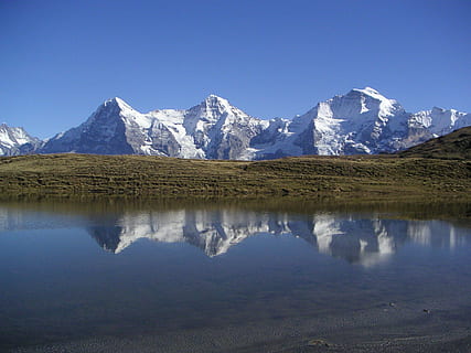 Eiger, munk, jomfru, bjerge, grindelwald, vinter, Schweiz, alpine, nordmuren, sne, himmel, bjerg, scenics - natur, rolig scene, ro, afspejling, vand, skønhed i naturen, skyfri himmel, natur, bjergkæde, blå, havnefronten, dag, ingen mennesker, sø, kopiere plads, idyllisk, landskab, snedækket bjerg, udendørs, formation, 1080P, CC0, offentligt domæne, royaltyfrie