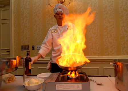 man cooking, portable, stove, holding, gray, frypan, Chef, Cooking, Culinary, Cuisine, Flames, strawberries, flambe, competition, hot, dish, gourmet, preparation, skill, flame, heat - temperature, burning, indoors, one man only, one person, fire, fire - natural phenomenon, kitchen utensil, kitchen, food, food and drink, adult, household equipment, domestic room, cooking pan, occupation, appliance, preparing food, uniform, 1080P, CC0, public domain, royalty free