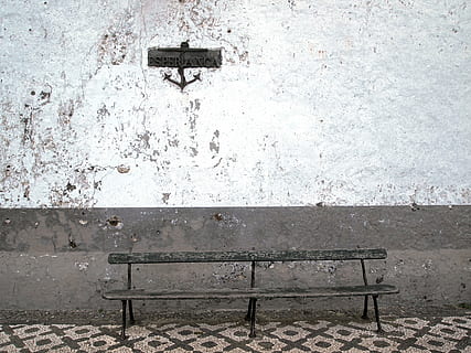 empty, brown, bench, beside, white, gray, wall, behind, concrete, anchor, wood, stones, no people, day, outdoors, close-up, wall - building feature, seat, old, architecture, absence, weathered, built structure, metal, wood - material, nature, abandoned, building exterior, domestic room, 4K, CC0, public domain, royalty free