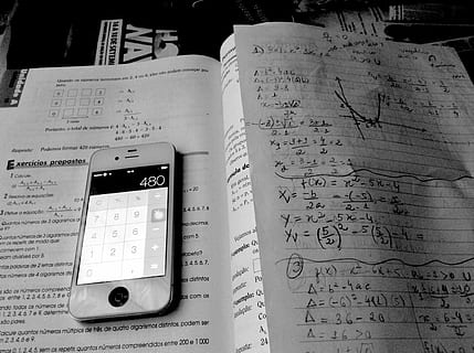 turned-on iphone 4, displaying, calculator 480, workbook, iphone, mathematics, study, communication, technology, paper, text, no people, close-up, connection, wireless technology, still life, number, indoors, mobile phone, western script, publication, book, high angle view, table, document, 1080P, CC0, public domain, royalty free