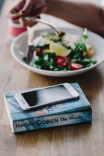 eating, breakfast, reading, book, Woman, female, healthy, meal, salad, food, table, close-up, food and drink, indoors, vegetable, healthy eating, selective focus, wireless technology, communication, technology, wellbeing, mobile phone, plate, portable information device, bowl, freshness, wood - material, smart phone, 2K