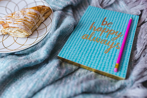 blue, notebook, pink, headphones, sweet, bun, iPhone, sweet bun, happy, smartphone, diary, textile, indoors, wool, no people, close-up, homemade, text, still life, selective focus, food, western script, multi colored, food and drink, high angle view, bed, furniture, paper, linen, clothing, table, 5K