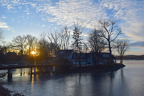 lake, sunset, reflection, ice, tree, nature, house, sun, sky, clouds, landscape, outdoor, blue, park, winter, sunlight, water, architecture, built structure, cloud - sky, building exterior, no people, waterfront, plant, building, bare tree, river, scenics - nature, 4K, CC0, public domain, royalty free